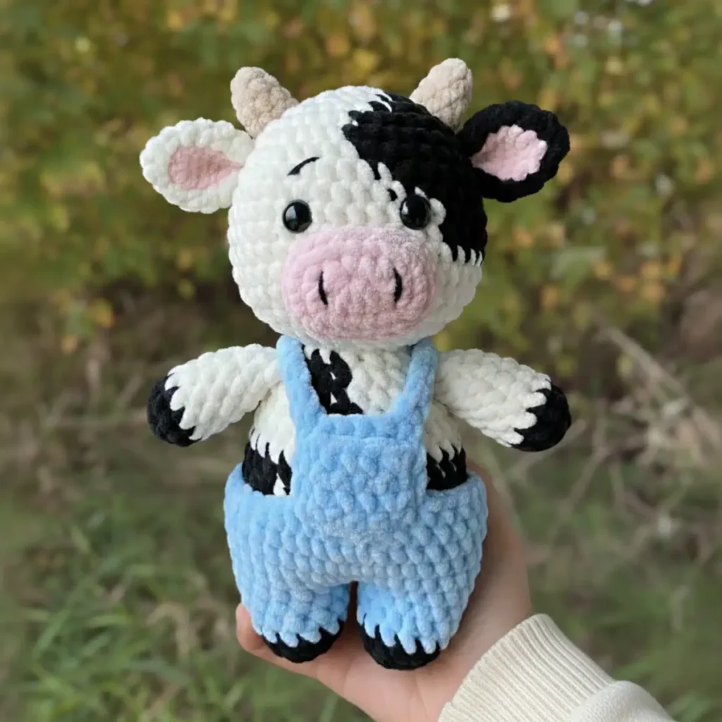Little cow amigurumi with spots and overalls