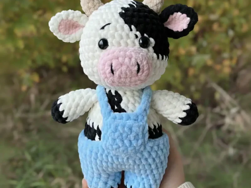 Little cow amigurumi with spots and overalls
