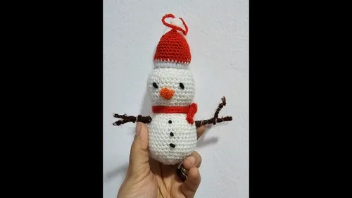 Crochet snowman ornament pattern for a festive touch