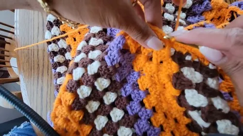 A flowing crochet dress in cream, brown, orange and purple — photo 2