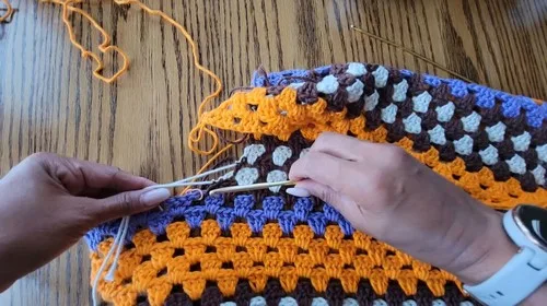 A flowing crochet dress in cream, brown, orange and purple — photo 4