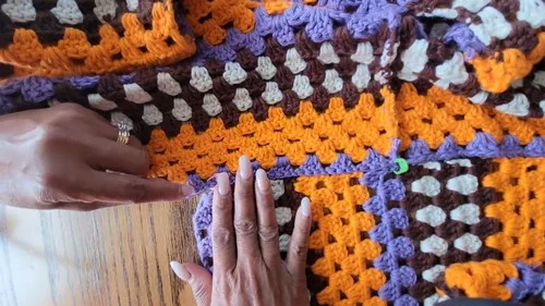 A flowing crochet dress in cream, brown, orange and purple — photo 5