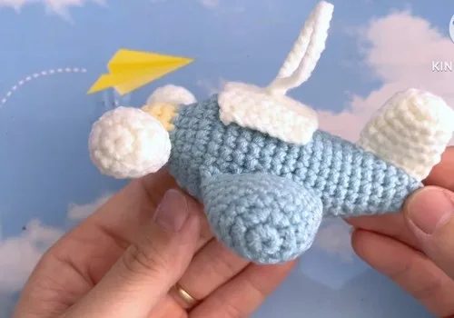 Little crochet airplane amigurumi with wings and propellers