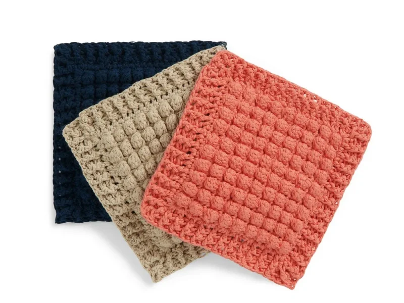 Textured bobble hot pads in warm autumn hues