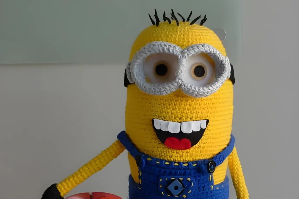 Crochet minion amigurumi with overalls and tiny hands